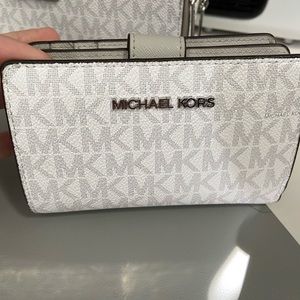 White and grey Michael Kors wallet